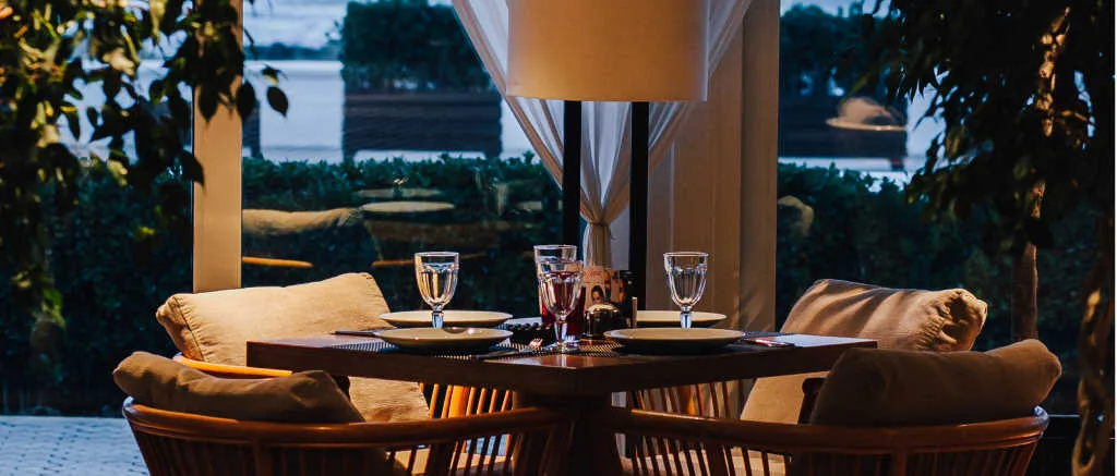 A table by a window onto the garden