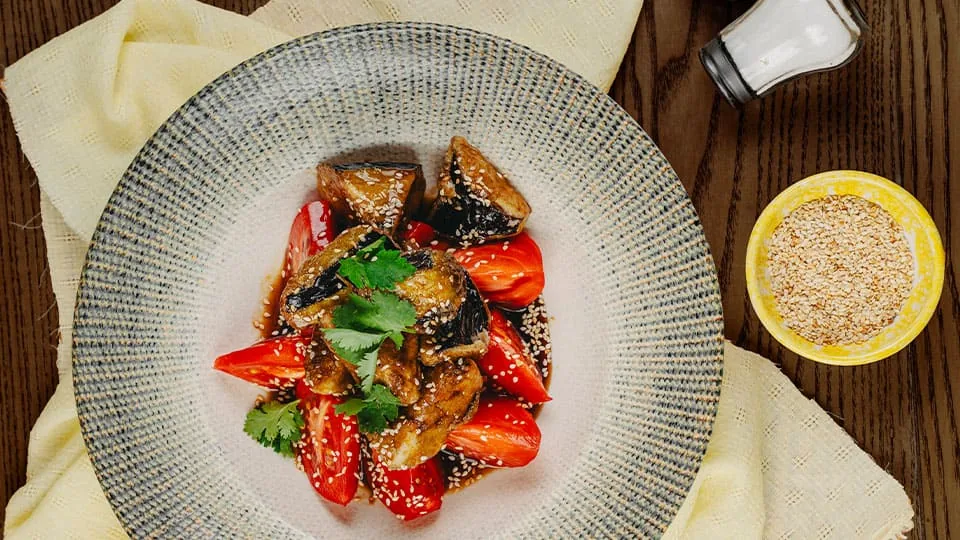 Eggplant with tomatoes and sesame
