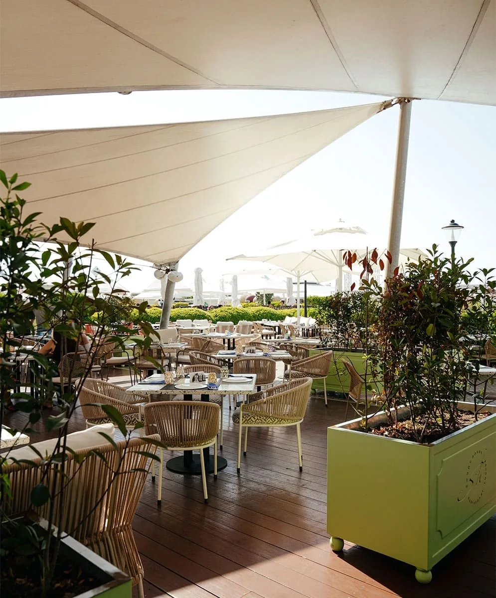 The terrace under white awnings